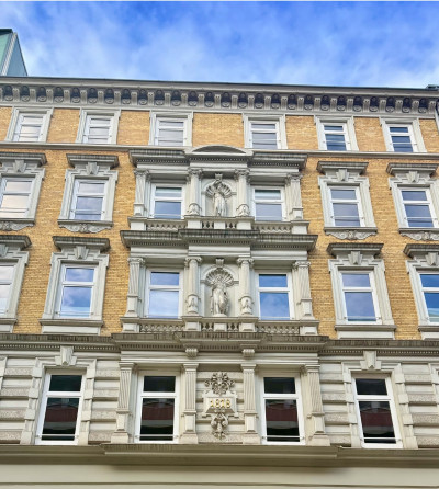 The facade of the building in the colonnades.